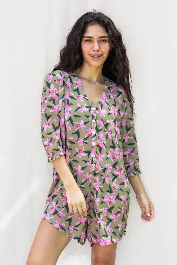 Floral Romper with small ruffle detail on the sleeve and a slight high low hem - Hawaiian Flower Print in Olive - Pink Orchid - Front View