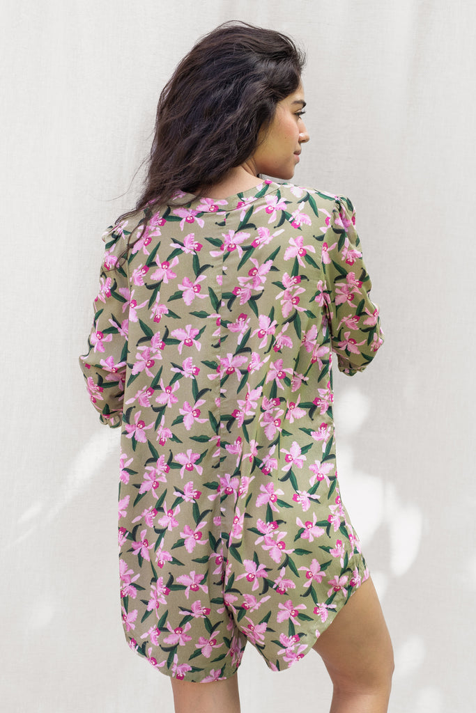 Floral Romper with small ruffle detail on the sleeve and a slight high low hem - Hawaiian Flower Print in Olive - Pink Orchid - Back View