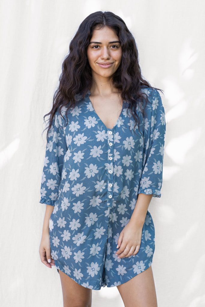 Floral Romper with small ruffle detail on the sleeve and a slight high low hem - Hawaiian Flower Print in Blue - Agave - Front View
