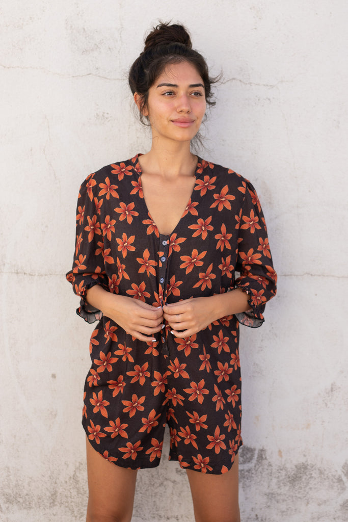 Floral Romper with small ruffle detail on the sleeve and a slight high low hem - Hawaiian Flower Print - Papaya Lily - Front View