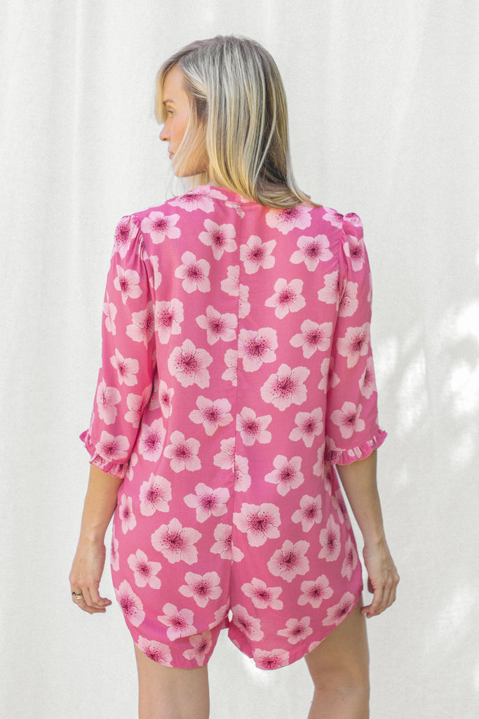 Romper with small ruffle detail on the sleeve and a slight high low hem - Hawaiian Floral Pink Print - Aurora - Back View